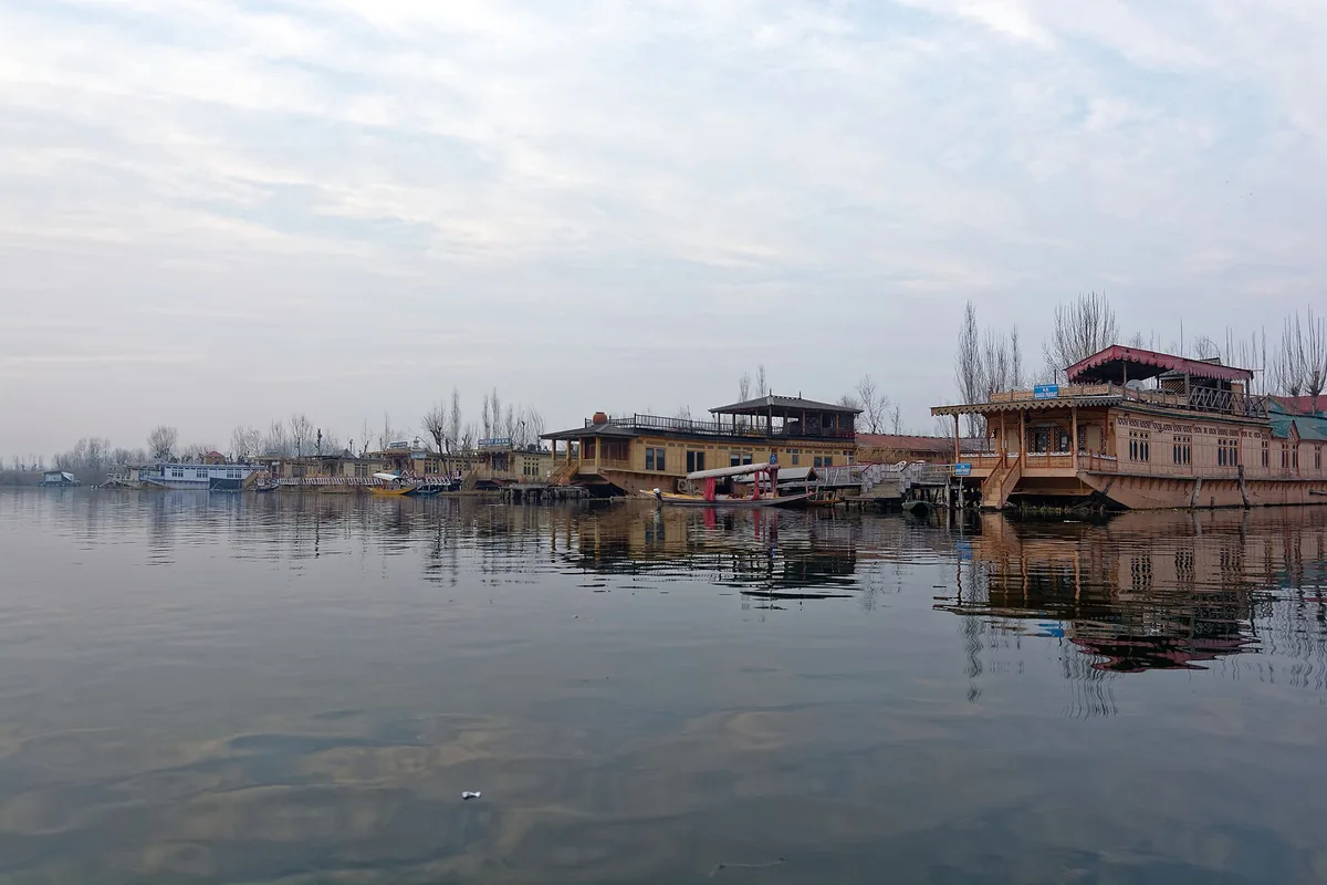 Traditional wooden houseboats lined along Dal Lake in Srinagar, Kashmir