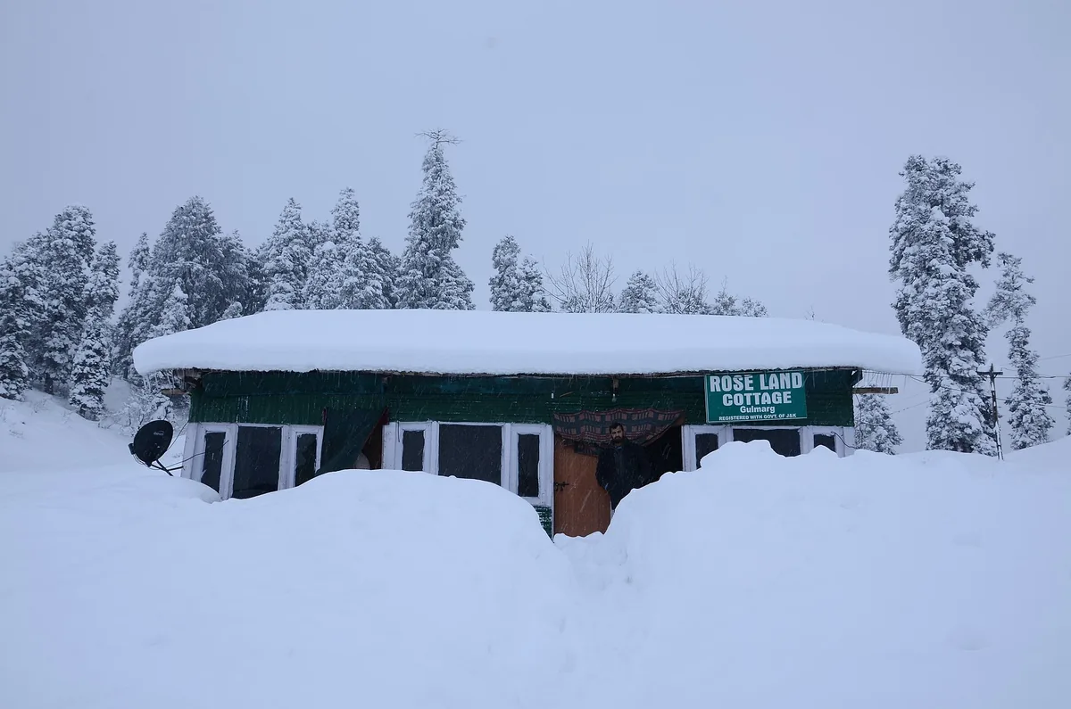 Snow-covered wooden hut in Gulmarg, Jammu and Kashmir, in winter
