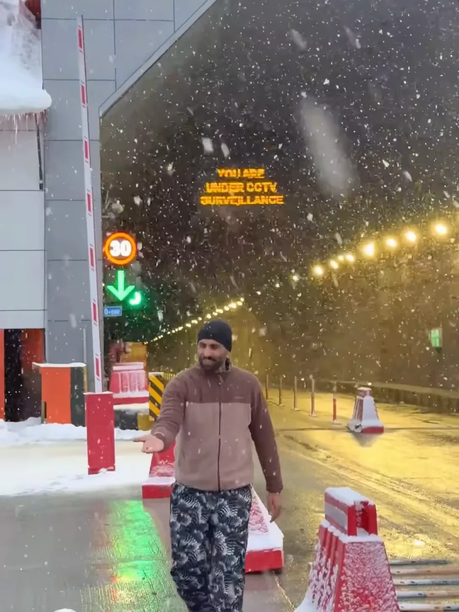 Snow falling on the road outside the Sonamarg Tunnel on 13 October 2026, from our reel